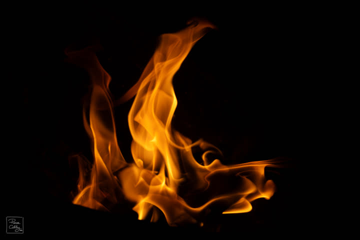 Large burst of orange flames on a black background