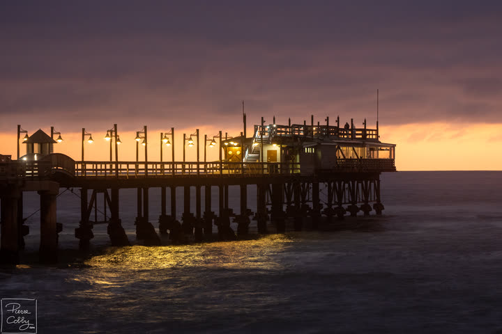 The Jetty restaurant in Swakopmund lit at dusk over the sea