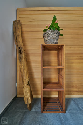 Wooden shelf with a plant in the wellness area