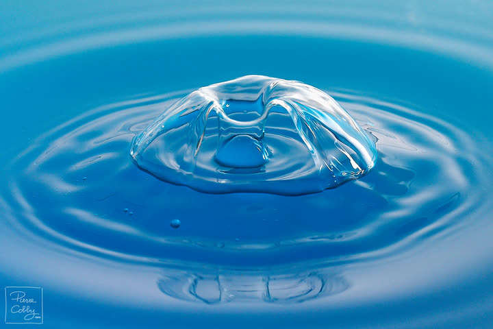 Translucent water dome with ripples on blue water