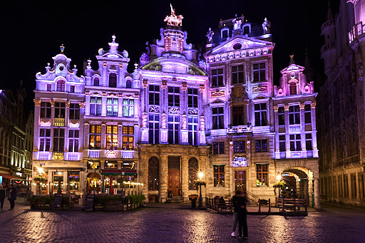 Kissing couple in Grand-Place of Brussels during the evening