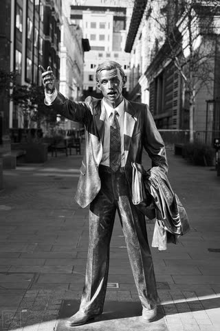 Taxi! bronze sculpture by J. Seward Johnson Jr. in London